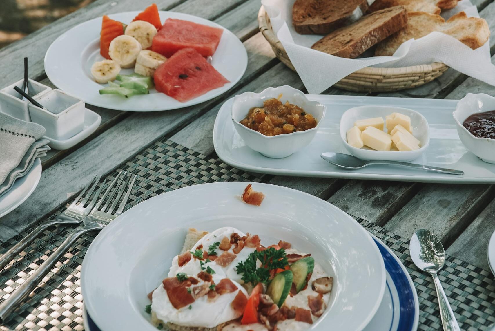 Delicious outdoor breakfast setting with fresh fruits and bread in Sri Lanka.