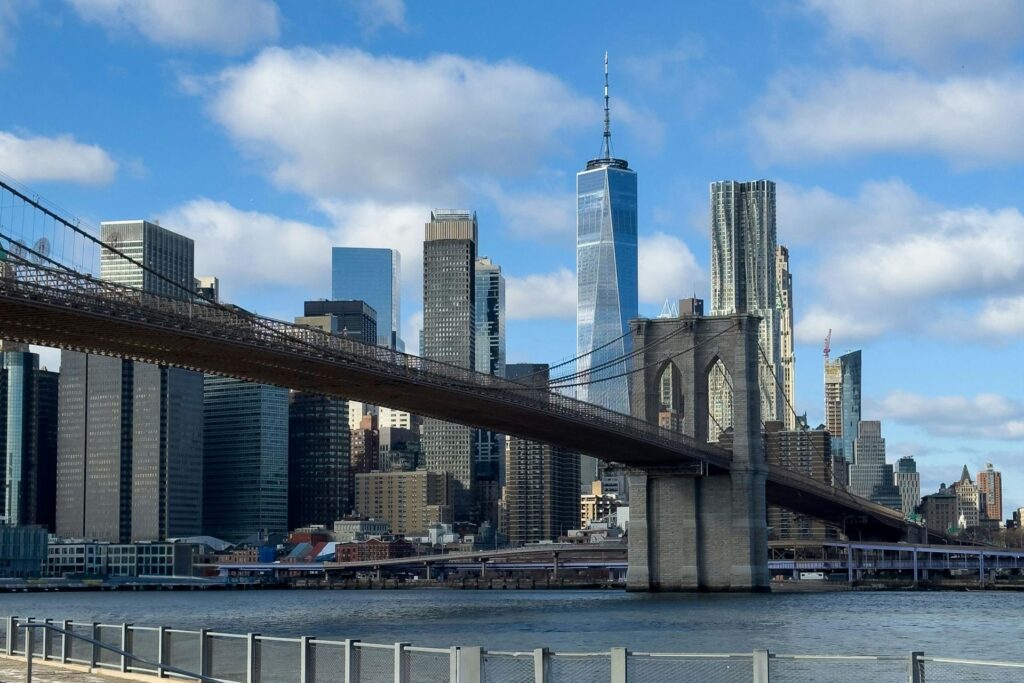 Scenic view of the Brooklyn Bridge and Manhattan skyline on a clear day.